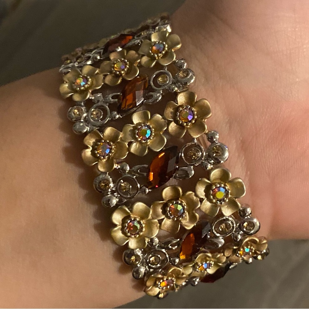 Gold flower bracelet.